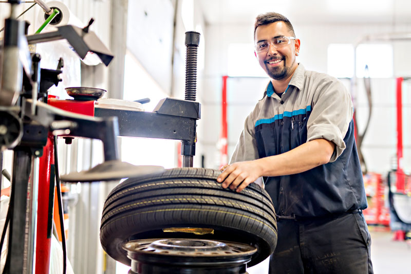 Mechanic changing a car tire